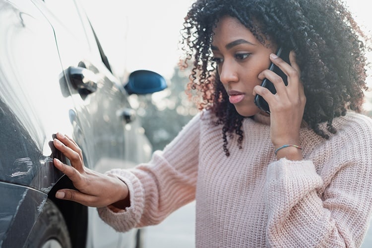 a young lady talks on the phone